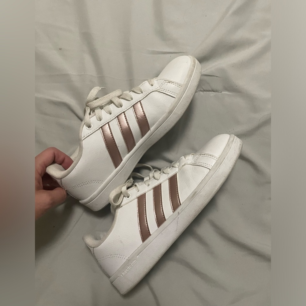 White adidas with rose gold stripes